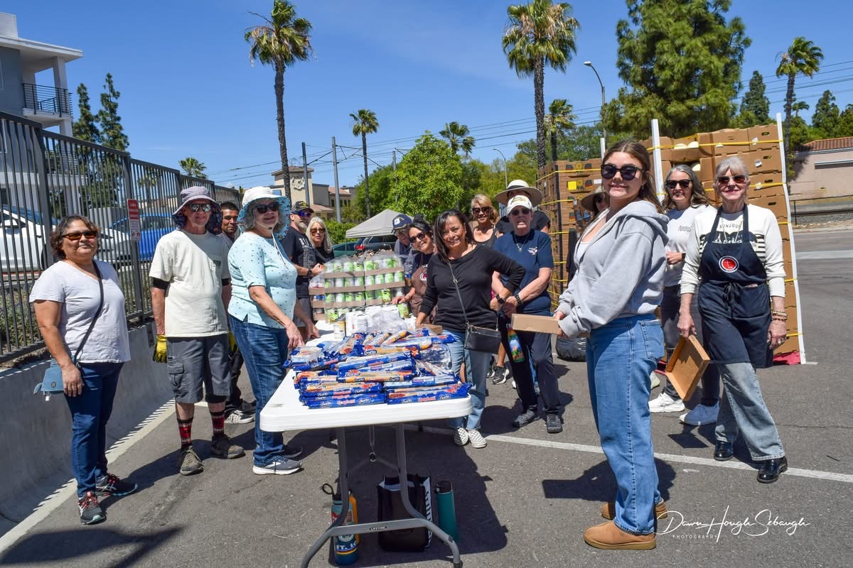 Community volunteers supporting a local food outreach event